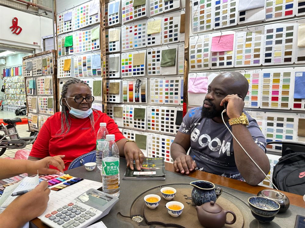 Buyer discussing fabric swatches
